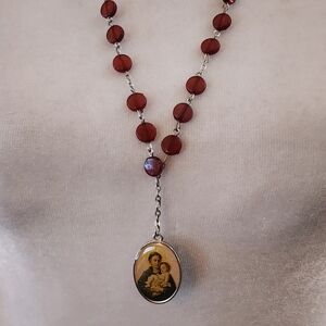 Silver Toned Rosary With Red Acrylic Beads With Saint Anthony Oval Pendant